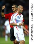 Small photo of Berlin, GERMANY - July 09, 2006: Zinedine Zidane looks at referee Horacio Elizondo after he showed him a red card during the 2006 FIFA World Cup Germany Final Italy v France at the Olympiastadion