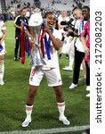Small photo of Turin, ITALY - May 21, 2022: Emelyne Laurent of Olympique Lyonnais lifts the trophy after winning the UEFA Women's Champions League Final Barcelona FC v Olympique Lyonnais at the Juventus Stadium.