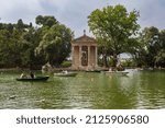 Small photo of Rome, Italy, June 27, 2014: Visitors of the gardens of the Villa Borghese in Rome, Italy, navigate rowboats near the Temple of Aesculapius during a summer day.