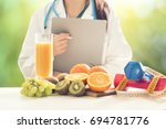 Small photo of Close up of a Female Dietician With Fresh Vegetables and fruits