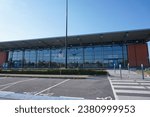 Small photo of Vatry, France - Sept. 9, 2023 - Glass facade of the passenger building of Paris-Vatry Airport, in front of the main car park; Vatry's airport is located near Chalons-en-Champagne, in Marne Department