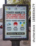 Small photo of London, UK - November 2, 2020: A sign warning people that the Tower Hamlets area has a very high level of covid, reminding people of hands, face, space