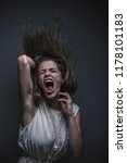 Small photo of Crazy, deranged young woman screaming with frustration, expressing madness and rage