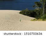 Liitle Boy Walking In Sand Dunes At Jessie M. Honeyman Memorial State Park