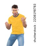 Soccer fan man with YELLOW jersey and face painted with the flag of the ECUADOR team screaming with emotion on white background.