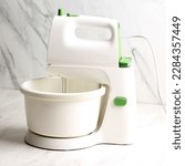 Small photo of Hand Mixer or Standing Mixer, Kitchen Device Beaters Batter Maachine. Gear Driven Mechanism to Rotate Beaters in a Bowl Containing Food or Cake Batter