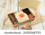Dosirak, Korean Style Packed Meal or Korean Lunchbox. Usually Use Gold Metal Box, Easy to Heat Up. Rice with Bulgogi, Kimchi, Sunny Side Egg, and Roasted Laver