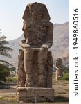 Small photo of Colossi of Memnon - the ancient guardians of the temple of Amenhotep III at the entrance to the nonexistent ruined burial temple, the city of the dead Luxor