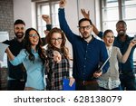 Happy group of successful company employees in office