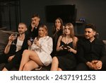 Small photo of Friends encircled by vibrant atmosphere of gaming arena at party. Women partake in spirited console gameplay forging bonds and creating lasting memories