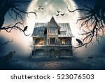 Haunted house with full moon in ...