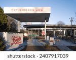 Small photo of Fort Mill, South Carolina, United States, 28 Dec 2023: Bossy Beulah's Chicken Shack in downtown Fort Mill, SC - Night-time charm with exterior lights and Southern flavors.