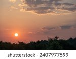 Small photo of A breathtaking sunrise over the trees as birds gracefully soar towards the emerging sun, creating a tranquil and serene morning landscape. Nature awakens with the dawn chorus, and the sun's glow.