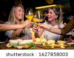 Girls having fun while drinking Wine during a brunch