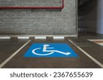 Close-up of a wheelchair parking space in an indoor parking lot. concept of accessible locations