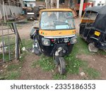 Small photo of Jalgaon, Maharashtra - India: July 04, 2023, three wheeler old taxi Auto Rikshaw, three wheeler taxi without seating cabin, Indian famous three wheeler Auto rikshaw Taxi, three wheeler taxi