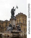 Small photo of Wurzburg, Germany - January 26, 2023: Frankonianbrunnen, sculptures decorated neo-baroque fountain on the Residenzplatz, in front of the Archbishopric Palace