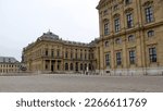 Small photo of Wurzburg, Germany - January 26, 2023: Residenzplatz, cobblestone square in front of the Archbishopric Palace, gloomy afternoon view