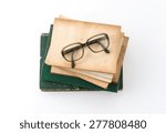 Old Book With Glasses On White...