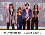Small photo of London, United Kingdom - February 08, 2022: Ethan Torchio, Victoria De Angelis, Damiano David and Thomas Raggi of Maneskin attend The BRIT Awards 2022 at The O2 Arena in London, England.