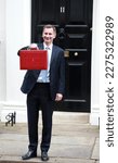 Small photo of London, United Kingdom - March 15, 2023: Jeremy Hunt leaves Downing Street with the despatch box to present his spring budget to parliament on March 15, 2023 in London, England.