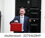 Small photo of London, United Kingdom - March 15, 2023: Jeremy Hunt leaves Downing Street with the despatch box to present his spring budget to parliament on March 15, 2023 in London, England.