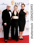 Small photo of London, United Kingdom - May 14, 2023: Dominic Savage, Mia Threapleton and Kate Winslet attend the BAFTA TV Awards at the Royal Festival Hall in London, England.