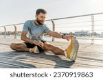 Small photo of Motivation fitness exercises warm-up stretching squats. Man training mental and physical health. Activity daily interval training.