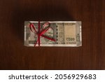 Five hundred Indian rupee notes tied with red ribbon. Concept for 'donate cash' or ' cash rewards'.