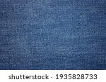 Blue jeans fabric background texture. Close up view.