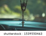 christian cross in the car background .