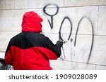 Worker Cleans Graffiti From A...