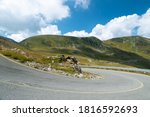 Mountain landscape with a curve in place. Transalpina road, Romania