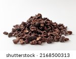 Small photo of cacao nibs on a white background