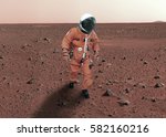 Astronaut walking on planet mars. 