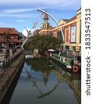 Small photo of Lincoln, UK October 2020 The River Witham flowing through Lincoln with its narrow boats serving beverages to passing shoppers, the clock tower and the famous Stokes Restaurant and coffee house.