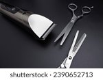 Small photo of Hairdressing scissors and Machine for a hairstyle on black background. Hairdresser salon equipment concept, premium hairdressing shears. Accessories for haircut. Men beauty and health concept