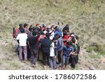 Small photo of A group of mountain climbers team is gathering and tossing / slogging in the valley of Gunung Lawu, Magetan, Indonesia. July 2020.