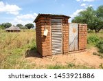 Outdoor latrine in rural uganda with hand washing station