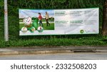 Small photo of SINGAPORE - 16 JUL 2023: KEEP SINGAPORE CLEAN banner at Yio Chu Kang Crescent Road bordering a secondary forest. It educates joggers, cyclists and passersby to bin their unwanted thrash.