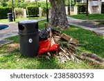 Small photo of SINGAPORE - 7 NOV 2023: Lentor Estate. The black thrash bin is meant for collection of garden waste from the playground, but people dump non-garden waste like brooms, boxes and plastic in the area.