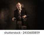 Small photo of Ghost of Jacob Marley, Scrooge ex-business partner, chained with a padlock, carrying treasure chests and keys