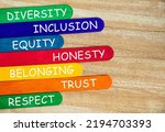 Small photo of Diversity, inclusion, equality, honesty, belonging, trust and respect text on colorful wooden stick - Business culture concept