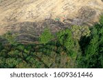 Small photo of Deforestation. Aerial photo of rain forest destroyed to make way for agricultural land. Southeast Asia