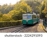 Small photo of Historic Rack Railway train on a small in Konigswinter Germany. Old electric railcar on descent from “Drachenfels“, a popular tourist attraction near Bonn in romantic Rhine valley in sunny October.