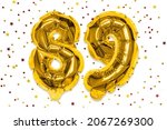 Small photo of The number of the balloon made of golden foil, the number eighty-nine on a white background with multicolored sequins. Birthday greeting card with inscription 89. Numerical digit, Celebration event.