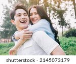Portrait of young Asian couple outside