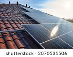 Photovoltaic panels on the roof . Roof Of Solar Panels. View of solar panels (solar cell) in the roof house with sunlight