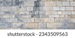 Small photo of wide impressive old castle stone wall. Panoramic stone wall background for design with copy space.