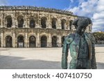 Roman Arena (Amphitheater) in Arles and bullfighter sculpture, Provence, France